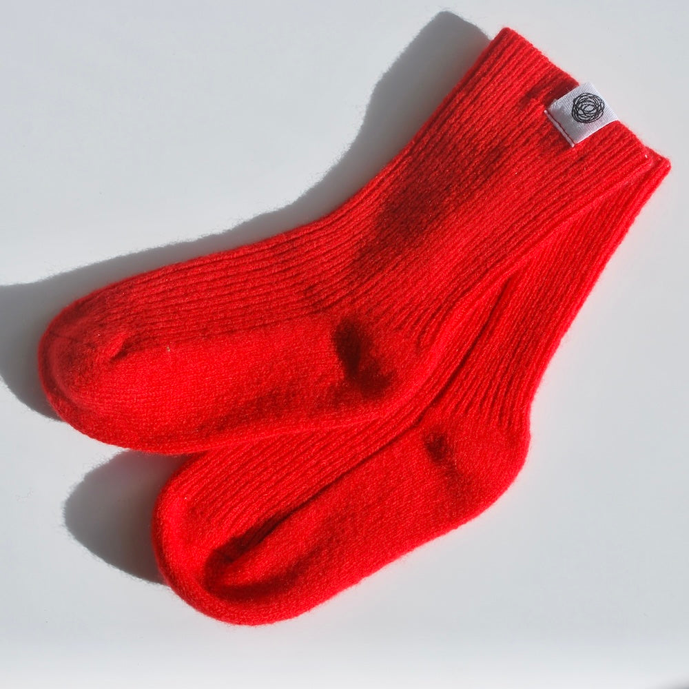 Lille Barn stickad socka - Lava